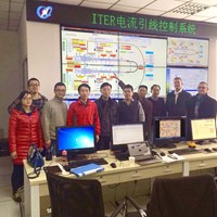 From left to right, the test team and witnesses—Du Qing (ASIPP); Wu Song (ITER China); Seungje Lee (ITER Organization); Ding Kaizhong (ASIPP); Lu Kun (ASIPP's feeder team leader); Niu Erwu (ITER China); Yifeng Yang, Wu Songtao, Arend Nijhuis, and Arnaud Devred (Superconductor & Auxiliaries Section leader) from ITER—stand in the ASIPP test hall control room, in front of the MIMIC screen generated by the ITER control system. (Click to view larger version...)