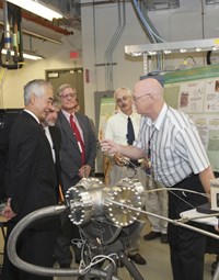 Director-General Motojima was the operator during a pellet injection laboratory test. Also in the picture: US ITER Project Manager Ned Sauthoff; ITER Deputy Director-General Gary Johnson; and ORNL researchers Stephen Combs and Larry Baylor. (Click to view larger version...)