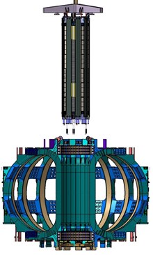 The assembled central solenoid hanging over the tokamak for installation. (Click to view larger version...)