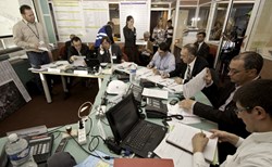 The objective was to test not only CEA-Cadarache's response to a major earthquake, but also to analyze the decision-making process between the different parties involved. Here the ''War Room,'' where actions were coordinated. (CEA-Cadarache Director Maurice Mazière is 4th from right.) (Click to view larger version...)