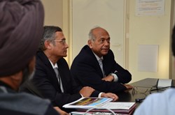 Srikumar Banerjee, the chairman of the Indian Atomic Energy Commission (right), and ITER Deputy Director-General Dhiraj Bora, talking to Indian staff members. (Click to view larger version...)
