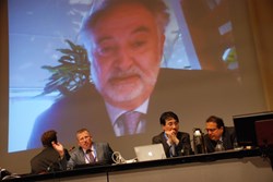 The head of ITER Communication Michel Claessens (2nd from left), chairs a session with Jacques Attali, who came in via video. (Click to view larger version...)