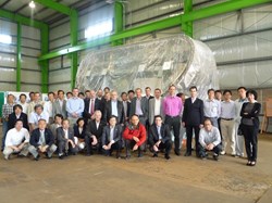 Group photo taken in September 2011, during the 12th Technical Coordination Meeting, in front of the first 40° sector of vacuum vessel. (Click to view larger version...)