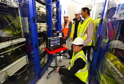 The core of the infrastructure is located in a technical room in the basement of ITER Headquarters. The software undergoes rigorous testing before release. Left to right: Xavier Mocquard, Anders Wallander, Changseung Kim and Petri Mäkijärvi. (Click to view larger version...)