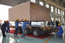 Workers at ASIPP are busy preparing to load the 737 metres of dummy conductor for ITER's poloidal field coil number five. (Click to view larger version...)