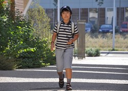 A determined youngster heading for his first day in class. (Click to view larger version...)