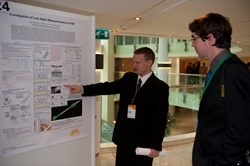Monaco Postdoctoral Fellow Evgeny Veshchev during the poster session, explaining his research. (Click to view larger version...)