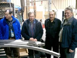 In front of the central solenoid conductor jacket bending trials, from left to right: Chris Rey (US-DA), Paul Libeyre (ITER), Charles Lyraud (ITER) and Wayne Reiersen (US-DA). (Click to view larger version...)