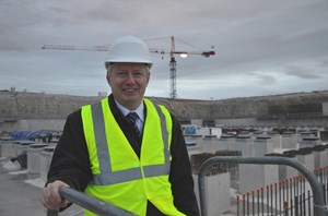 Taking a look at the big hole that will hold the machine: Alexander Alekseev, the new head of the Directorate for Tokamak. (Click to view larger version...)