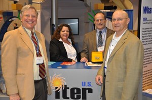 Holding up the ITER flag: Ned Sauthoff, Jamie Payne, Brad Nelson and Carl Strawbridge in front of the ITER stand at this year's AAAS conference. (Click to view larger version...)