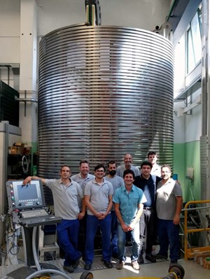 ICAS representatives stand in front of the last spool of poloidal field conductor. The material—some seven kilometres in all—will now be tested before shipment to China, where the sixth poloidal field magnet (PF6) will be manufactured. (Click to view larger version...)