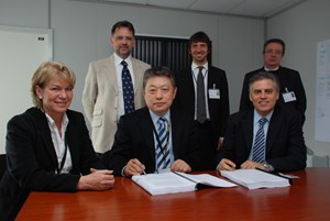 Standard procedure for a non-standard endeavour: (1. row f. left) Francoise Flament, Head of ITER Contract & Procurement Division, Deputy Director-General Yong-Hwan Kim and CESI Director Domenico Villani; Ivone Benfatto, head of the ITER Electrical Engineering Division; CESI Marketing Manager Andrea Meola; and Marino Valisi. (Click to view larger version...)