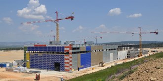 The united colours of ITER will eventually merge into champagne and orange. (Click to view larger version...)