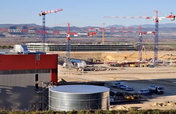 The three projects that transformed the ITER platform in 2011: the Poloidal Field Coils Winding Facility (foreground) which will be ''signed and delivered'' during the first weeks of January; the excavation of the Tokamak Pit and ongoing foundation works; and—in the distance—the ITER Headquarters. (Click to view larger version...)