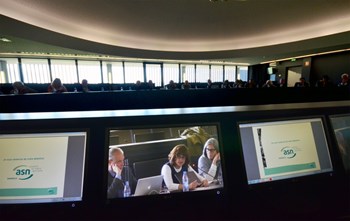 Following the ASN presentation, acting division head for Nuclear Safety, Licensing & Environmental Protection Joëlle Elbez-Uzan, (center, on the video screen) answered the questions from the public. (Click to view larger version...)
