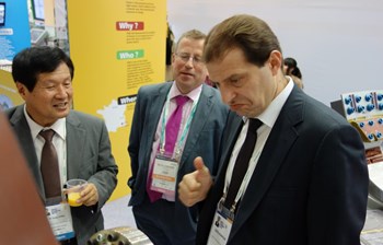 A delegate from the Turkish Ministry of Energy and Natural Resources is clearly impressed by the blanket module mockup on show at the ITER stand. Standing nearby are (left) Kijung Jung, head of ITER Korea, and Michel Claessens, Head of ITER Communication & External Relations. (Click to view larger version...)