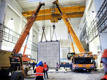 Workers installed the main door of the SPIDER bioshield in April. Sliding along rails, this 120-tonne door will be the point of entry for component installation. (Click to view larger version...)