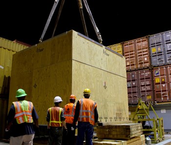 The 800-metre sample toroidal field conductor was transferred to a container ship at the port of Charleston, South Carolina, on 28 May for its voyage to the European winding facility in La Spezia, Italy. Photo: US ITER (Click to view larger version...)