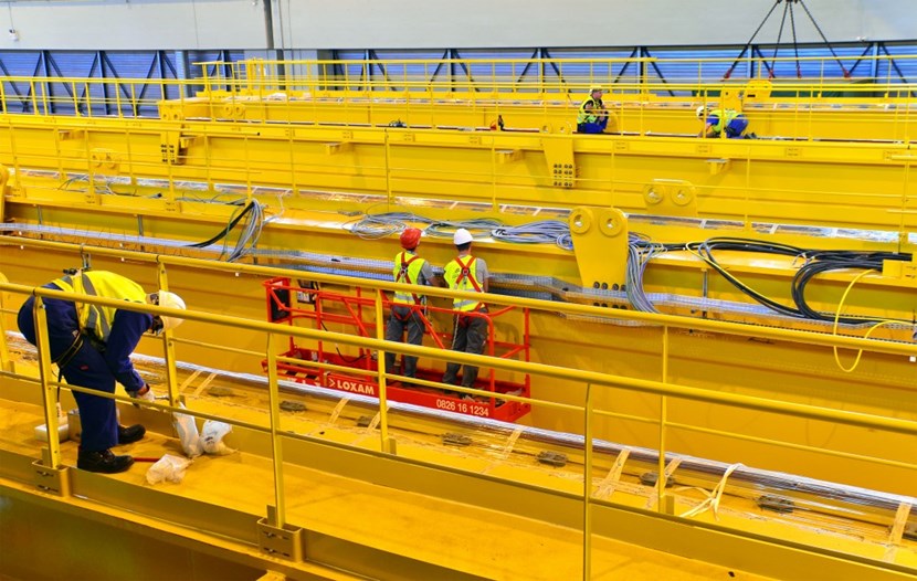 In the Poloidal Field Coils Winding Facility workers are busy installing the accessories and electrical equipement of the four 155-tonne girders that will form the Assembly Hall's double overhead travelling crane. (Click to view larger version...)
