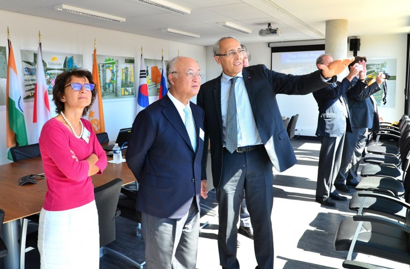 The ITER Director-General's office, on the fifth floor of the Headquarters Building, offers a striking view of the construction site. From left to right, Anne Lazar-Sury, French governor at IAEA, IAEA Director General Amano, ITER Director-General Bigot, and Jean-Louis Falconi, French ambassador to the IAEA. (Click to view larger version...)