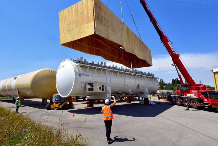 A ''box-opening'' operation took place last week at the entrance of the ITER site where large components are stored. Three large elements of the liquid helium plant (''cold boxes'') were uncovered to prepare for their transport and installation in the ITER cryoplant. (Click to view larger version...)