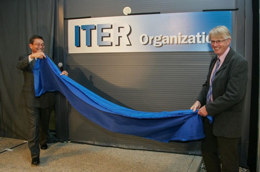 Director-General Nominee Kaname Ikeda (left) and his second-in-command Norbert Holtkamp unveil the ITER Organization plaque at the entrance of the prefabricated building that already accommodated 170 ''ITER people.'' (Click to view larger version...)