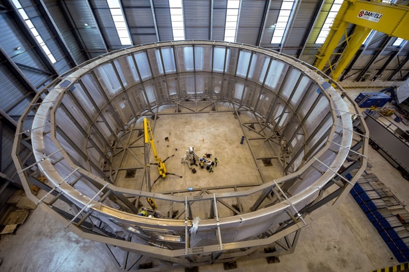 Operators in the centre provide a sense of scale. The cryostat lower cylindre is more than 10 metres tall and approximately 30 metres in diameter. And it represents only one out of four sections ... (Click to view larger version...)