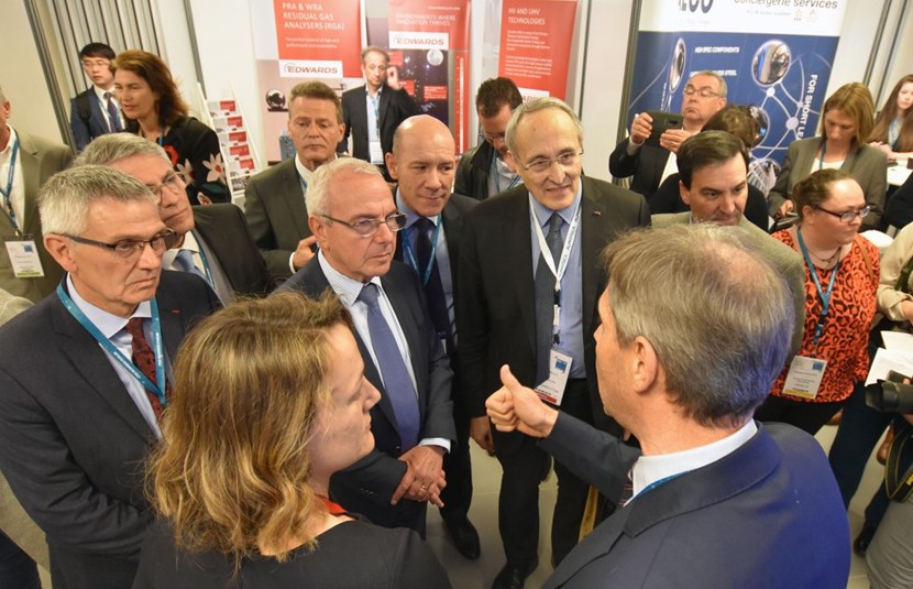 The Director of Agence Iter France, Jacques Vayron (far left), leads the traditional tour of the exhibition stands. The European Commission's Gerassimos Thomas, Deputy Director-General for Energy; mayor of Antibes Jean Leonetti; Fusion for Energy Director Johannes Schwemmer; Daniel Sfecci, representing the Nice-Côte d'Azur Chamber of Commerce and Industry; and ITER Director-General Bernard Bigot listen to representatives of the engineering group Assystem. (Click to view larger version...)