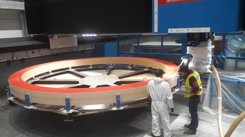Dimensional measurements are performed before final machining. The five-metre-in-diameter, three-tonne components will be installed in sets of three at the top and bottom of the toroidal field coil structures to ''push back'' against deflection. (Three other rings will be manufactured as spares.) © CNIM (Click to view larger version...)