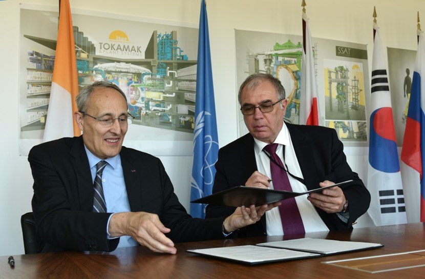 ITER Director-General Bernard Bigot signs the IAEA-ITER Practical Arrangements in the presence of Mikhail Chudakov, IAEA Deputy Director General and Head of the Department of Nuclear Energy. (Click to view larger version...)