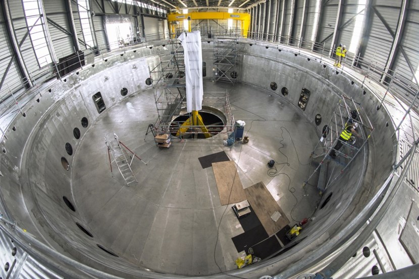 Resembling a soup dish, or an upside down hat, the cryostat base is the heaviest single component of the ITER machine. It is also the first major lift of the ITER assembly phase. By March 2020, the completion of the Tokamak Building roof and the extension of the assembly crane rails will permit this component to be installed in the Tokamak Pit. (Click to view larger version...)
