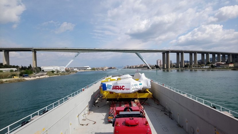 Procured by Europe and finalized in Italy, toroidal field coil #9 (TF9) is seen here on 23 March as it approaches the narrow Caronte Canal in Martigues. The massive load (600 tonnes) will reach the ITER site in the early morning of 17 April. Photo DAHER (Click to view larger version...)