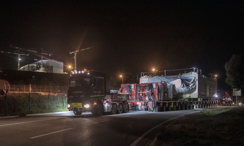 It is close to 2:00 a.m. and the journey from the other side of the world is almost over. Framed against the backdrop of the Tokamak Complex, the convoy will now take the heavy-haul road to the construction platform. (Click to view larger version...)