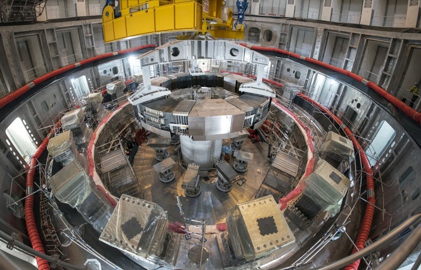 As PF6 slowly descends into the assembly pit, the eight-hour operation comes to an end. The coil will remain on temporary supports during the installation of all nine vacuum vessel sector sub-assemblies. (Click to view larger version...)