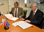 The delegation of responsibility was formalized on Monday 21 February with the signature of a convention by ITER Director-General Osamu Motojima (right) and Agence Iter France Director Jérôme Pamela.