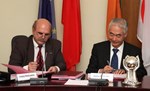 Anatoly Krasilnikov, head of the Russian Domestic Agency, and ITER Director-General Osamu Motojima signing Procurement Arrangement numbers 49 and 50 this week.