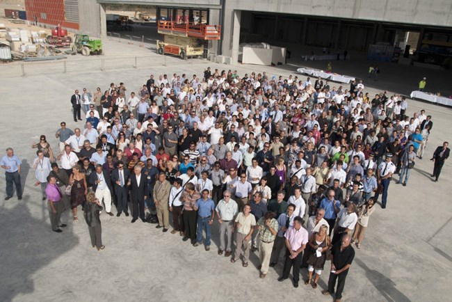 The ITER team this afternoon gathering in front of the large PF Coils Winding Facility. 