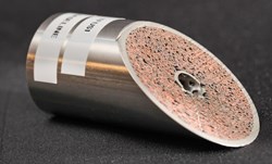 A sample of the toroidal field cable conductor (4.37 cm in diameter) shows how densely the niobium-tin wire will be compacted within the stainless steel exterior jacketing. The hole in the centre will permit liquid helium to flow through the conductor for cooling. Photo: US ITER/ORNL (Click to view larger version...)