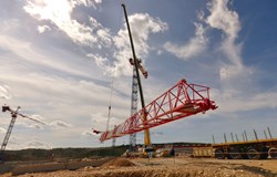 ''The only real difficulty,'' explains a crane dismantling specialist ''is the wind. Also ... finding enough room to lay the boom on the ground ...'' (Click to view larger version...)