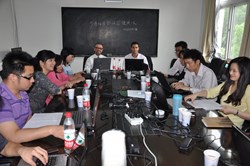ITER's Arnaud Devred and colleague Gregory Bevillard during a training session in China, language lesson included. (Click to view larger version...)
