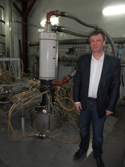 Gregory Denisov, standing next to a gyrotron developed for ITER in Nizhny Novgorod, Russia. (Click to view larger version...)