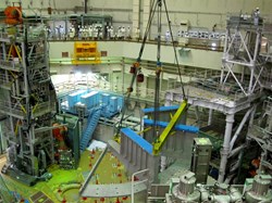 One of the lower structure sectors of the cryostat base as it is assembled in the torus hall on 28 January in the presence of the media. (Click to view larger version...)