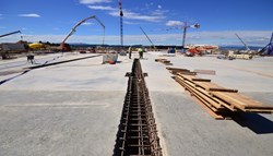 The last segment of concrete for the Assembly Building basemat was poured on 21 May, wrapping up six months of pouring activity. The joints between segments will be completed by early June. (Click to view larger version...)