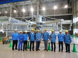 At Mitsubishi Heavy Industry's Futami plant, participants to the meeting are photographed in front of the new MELCO transfer winding tool. Left to right: Tomohiro Okawa, Takashi Miyake and Naoki Sawa (MHI); Hideki Kajitani (Japanese Domestic Agency, JA-DA); Neil Mitchell, head of the ITER Magnets Division, and Arnaud Foussat, Section leader and Technical Responsible Officer; Norikiyo Koizumi (Technical Responsible Officer for JA-DA); Katsusuke Shimizu (MHI); and Yoshinobu Yamanaka (MELCO). (Click to view larger version...)