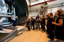 French President François Hollande had chosen the Air Liquide factory in Sassenage, near Grenoble, France, to showcase his environmental policy. He is seen here in the foreground listening to the presentation by the Air Liquide management of the company's involvement in the ITER Project. (Pictured, one of three ''cold boxes'' that will be part of ITER's liquid helium plant.) (Click to view larger version...)