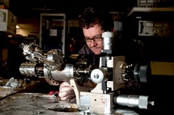 Artur Golczewski from the Vienna University of Technology mounting the high precision scale. Photo courtesy of the Vienna University of Technology. (Click to view larger version...)