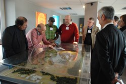Timothy Watson (2nd from left), Head of the ITER Directorate for Buildings and Site Infrastructure, explaining the main features of the ITER facilities to Rob Adams (4th from left) and the Nesca delegation. (Click to view larger version...)