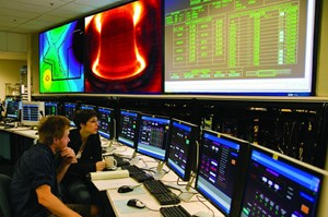 From the control room, graduate students perform experiments on the Alcator C-Mod tokamak to support their thesis work. (Click to view larger version...)