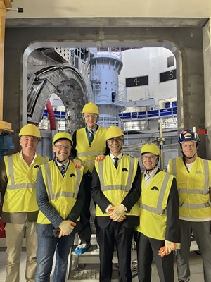 The DTT delegation framed by an equatorial port in the ITER cryostat, with the vacuum vessel Sector 6 in the tokamak pit visible in the background. From left to right: Stefano Carchella, Gian Mario Polli, Francesco Romanelli (President of the DTT Consortium), Piero Martin, and Marco De Santis. The author is at far right. Not pictured, Gustavo Granucci, the sixth member of the DTT delegation. (Click to view larger version...)