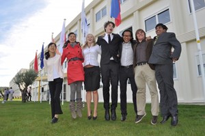 Liman, Jean-Daniel, Kaushal, Shoko, Unkyu, Lana and Christopher—the youngest among the ITER staff—hoisted the flag of their respective countries. (Click to view larger version...)
